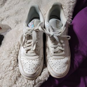 Silver and white Nikes